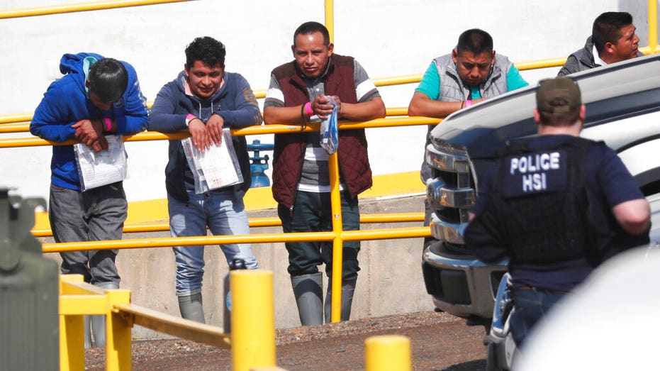 handcuffed illegal immigrant workers