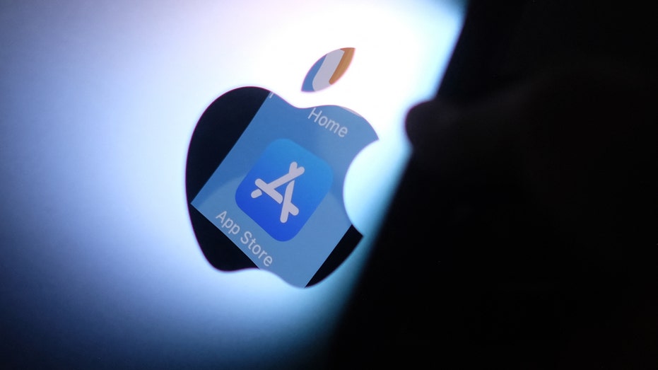 The Apple app store logo reflected on the back of an iPhone