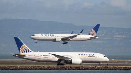 FILE PHOTO: A United Airlines Boeing 787 taxis as a United Airlines Boeing 767 lands at San Francisco International Airport, San Francisco, California, February 7, 2015. 