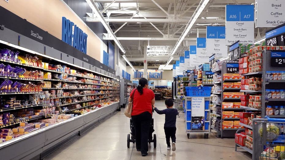 Woman and child walking in Walmart