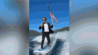 Billionaire dons tux in surfing video while holding beer and American flag