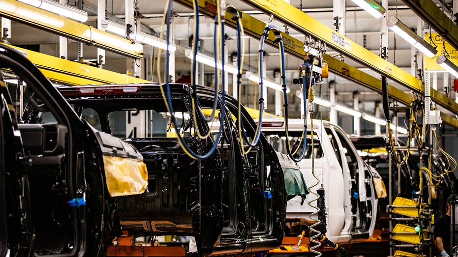 Vehicles on the assembly line at General Motors assembly plant