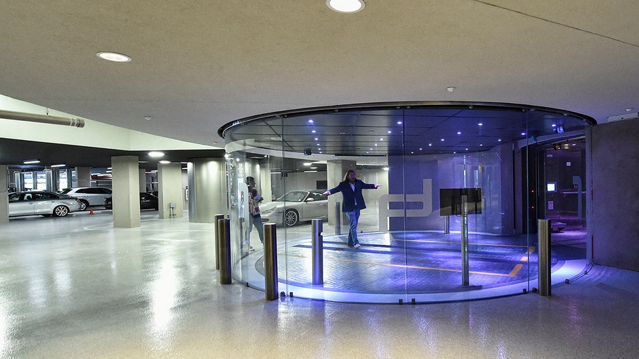 Developer Gil Dezer stands in the car elevator