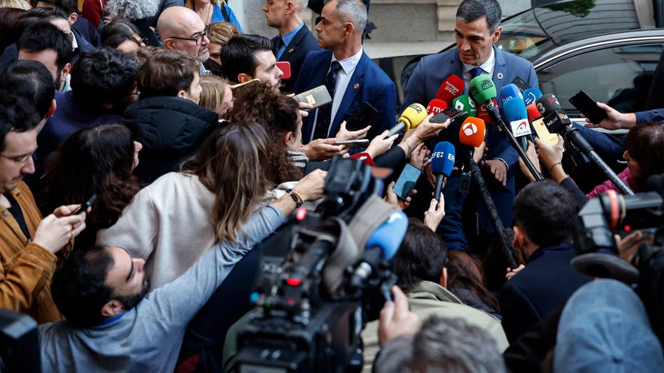 Spanish Prime Minister Pedro Sanchez talks to members of the media